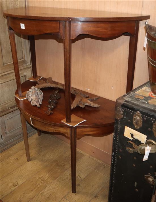 A pair of George III mahogany demi-lune side tables (dining table), each fitted drawer W.122cm